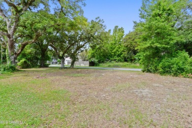 Corner lot adorned with magnificent live oaks, nestled in the on The Bridges Golf Club At Hollywood Casino in Mississippi - for sale on GolfHomes.com, golf home, golf lot