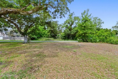 Corner lot adorned with magnificent live oaks, nestled in the on The Bridges Golf Club At Hollywood Casino in Mississippi - for sale on GolfHomes.com, golf home, golf lot