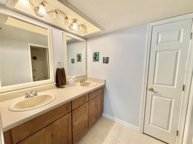 Charming and quiet 2-bedroom, 2-bath condo overlooking lush on Feather Sound Country Club in Florida - for sale on GolfHomes.com, golf home, golf lot