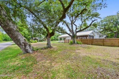 Corner lot adorned with magnificent live oaks, nestled in the on The Bridges Golf Club At Hollywood Casino in Mississippi - for sale on GolfHomes.com, golf home, golf lot