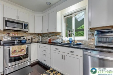 Located in the amenity-filled golf course community Country Club on Country Club of the Poconos Golf Course in Pennsylvania - for sale on GolfHomes.com, golf home, golf lot