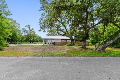 Corner lot adorned with magnificent live oaks, nestled in the on The Bridges Golf Club At Hollywood Casino in Mississippi - for sale on GolfHomes.com, golf home, golf lot