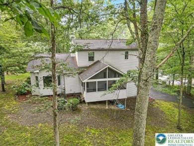 Located in the amenity-filled golf course community Country Club on Country Club of the Poconos Golf Course in Pennsylvania - for sale on GolfHomes.com, golf home, golf lot