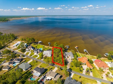 TRANQUIL BAYFRONT OPPORTUNITY | 101.1' OF WEST BAY FRONTAGE WITH on Holiday Golf Club in Florida - for sale on GolfHomes.com, golf home, golf lot