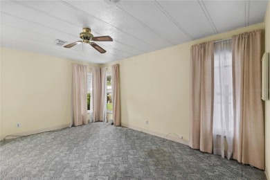 Well-maintained 2-bedroom, 2-bath manufactured home located in on Zellwood Station Country Club in Florida - for sale on GolfHomes.com, golf home, golf lot