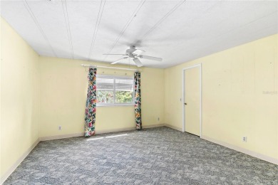 Well-maintained 2-bedroom, 2-bath manufactured home located in on Zellwood Station Country Club in Florida - for sale on GolfHomes.com, golf home, golf lot