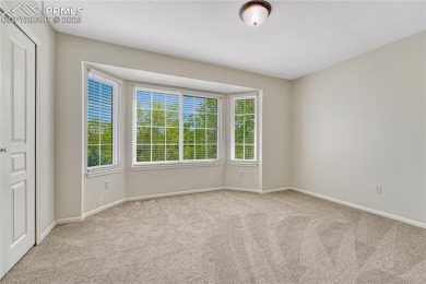 Nestled on a tree-lined street in the heart of District 20 and on Pine Creek Golf Club in Colorado - for sale on GolfHomes.com, golf home, golf lot