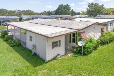 Well-maintained 2-bedroom, 2-bath manufactured home located in on Zellwood Station Country Club in Florida - for sale on GolfHomes.com, golf home, golf lot