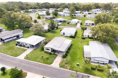 Well-maintained 2-bedroom, 2-bath manufactured home located in on Zellwood Station Country Club in Florida - for sale on GolfHomes.com, golf home, golf lot