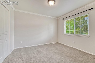 Nestled on a tree-lined street in the heart of District 20 and on Pine Creek Golf Club in Colorado - for sale on GolfHomes.com, golf home, golf lot