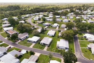 Well-maintained 2-bedroom, 2-bath manufactured home located in on Zellwood Station Country Club in Florida - for sale on GolfHomes.com, golf home, golf lot