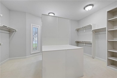 Nestled on a Charming Wooded Cul-de-sac, this Stunning 1.5-story on Shadow Glen Golf Club in Kansas - for sale on GolfHomes.com, golf home, golf lot