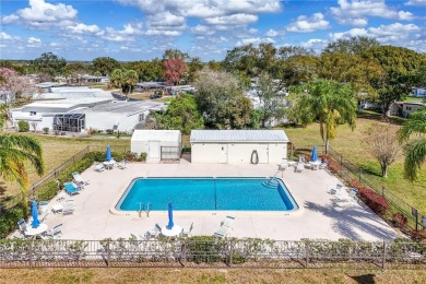 Well-maintained 2-bedroom, 2-bath manufactured home located in on Zellwood Station Country Club in Florida - for sale on GolfHomes.com, golf home, golf lot