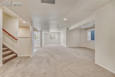 Nestled on a tree-lined street in the heart of District 20 and on Pine Creek Golf Club in Colorado - for sale on GolfHomes.com, golf home, golf lot