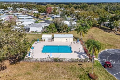 Well-maintained 2-bedroom, 2-bath manufactured home located in on Zellwood Station Country Club in Florida - for sale on GolfHomes.com, golf home, golf lot
