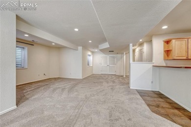 Nestled on a tree-lined street in the heart of District 20 and on Pine Creek Golf Club in Colorado - for sale on GolfHomes.com, golf home, golf lot