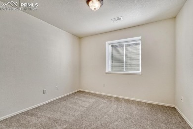 Nestled on a tree-lined street in the heart of District 20 and on Pine Creek Golf Club in Colorado - for sale on GolfHomes.com, golf home, golf lot