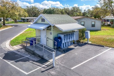 Well-maintained 2-bedroom, 2-bath manufactured home located in on Zellwood Station Country Club in Florida - for sale on GolfHomes.com, golf home, golf lot