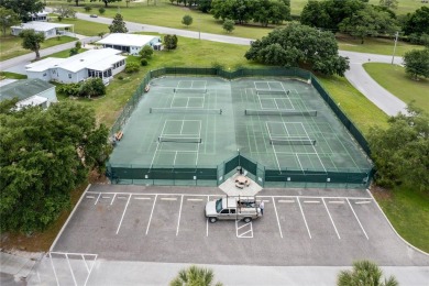 Well-maintained 2-bedroom, 2-bath manufactured home located in on Zellwood Station Country Club in Florida - for sale on GolfHomes.com, golf home, golf lot