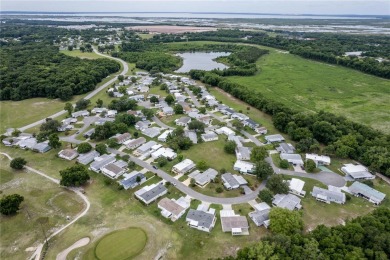 Well-maintained 2-bedroom, 2-bath manufactured home located in on Zellwood Station Country Club in Florida - for sale on GolfHomes.com, golf home, golf lot