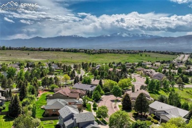 Nestled on a tree-lined street in the heart of District 20 and on Pine Creek Golf Club in Colorado - for sale on GolfHomes.com, golf home, golf lot