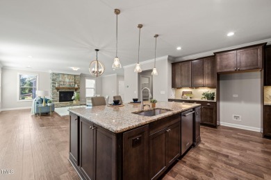Welcome to 1046 Covered Bridge Trail - a spacious and elegant on The Preserve At Jordan Lake Golf Club in North Carolina - for sale on GolfHomes.com, golf home, golf lot