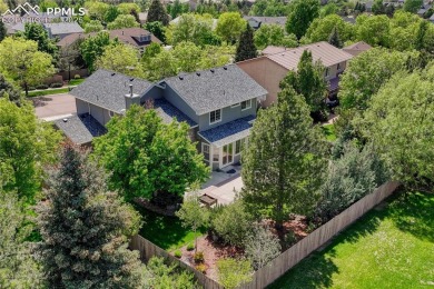 Nestled on a tree-lined street in the heart of District 20 and on Pine Creek Golf Club in Colorado - for sale on GolfHomes.com, golf home, golf lot