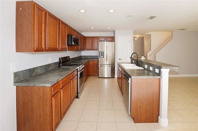 Discover relaxed living in the four bedroom, three bathroom on The Club At Pointe West in Florida - for sale on GolfHomes.com, golf home, golf lot