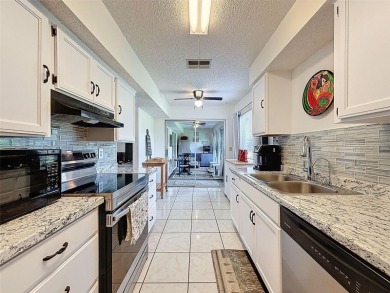 GROUND FLOOR CONDO located on the 8th Fairway of the Heather on Heather Golf and Country Club in Florida - for sale on GolfHomes.com, golf home, golf lot