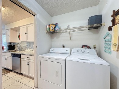 GROUND FLOOR CONDO located on the 8th Fairway of the Heather on Heather Golf and Country Club in Florida - for sale on GolfHomes.com, golf home, golf lot