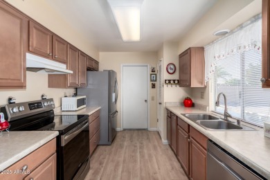 This lovely Sun City home is light & bright with an open concept on PalmBrook Country Club in Arizona - for sale on GolfHomes.com, golf home, golf lot