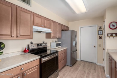 This lovely Sun City home is light & bright with an open concept on PalmBrook Country Club in Arizona - for sale on GolfHomes.com, golf home, golf lot