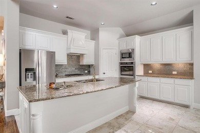 Gorgeous home with a stone & brick exterior and beautiful curb on Mansfield National Golf Club in Texas - for sale on GolfHomes.com, golf home, golf lot