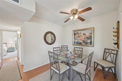 This one is a gem! With stylish finishes, wood flooring, cozy on Palm Aire Country Club of Sarasota in Florida - for sale on GolfHomes.com, golf home, golf lot