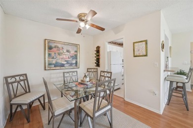 This one is a gem! With stylish finishes, wood flooring, cozy on Palm Aire Country Club of Sarasota in Florida - for sale on GolfHomes.com, golf home, golf lot