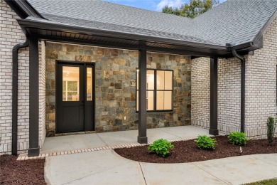 A showcase of impeccable craftsmanship, this new construction on Brookstone Meadows Golf Course in South Carolina - for sale on GolfHomes.com, golf home, golf lot