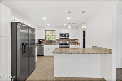 Discover the perfect blend of modern style and relaxed Florida on Daytona Beach Golf Club in Florida - for sale on GolfHomes.com, golf home, golf lot