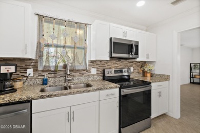 Discover the perfect blend of modern style and relaxed Florida on Daytona Beach Golf Club in Florida - for sale on GolfHomes.com, golf home, golf lot