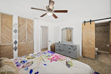 Discover the perfect blend of modern style and relaxed Florida on Daytona Beach Golf Club in Florida - for sale on GolfHomes.com, golf home, golf lot