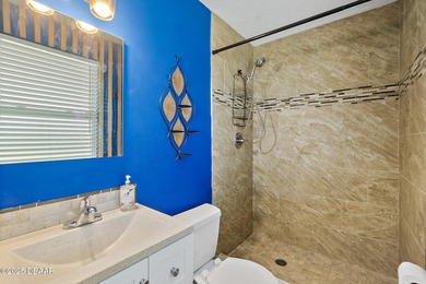 Discover the perfect blend of modern style and relaxed Florida on Daytona Beach Golf Club in Florida - for sale on GolfHomes.com, golf home, golf lot