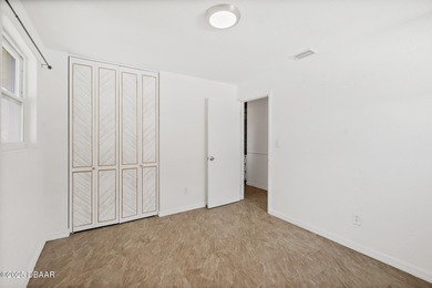 Discover the perfect blend of modern style and relaxed Florida on Daytona Beach Golf Club in Florida - for sale on GolfHomes.com, golf home, golf lot