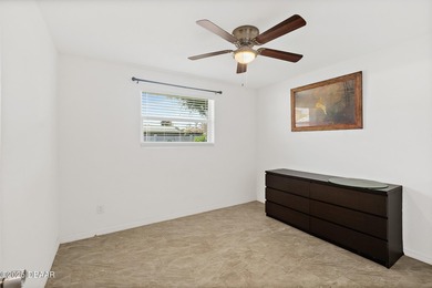 Discover the perfect blend of modern style and relaxed Florida on Daytona Beach Golf Club in Florida - for sale on GolfHomes.com, golf home, golf lot