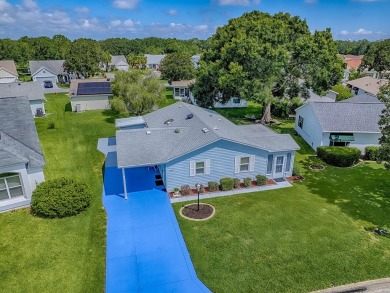 In the heart of The Villages, an exquisite retreat awaits those on El Diablo Executive Golf Course in Florida - for sale on GolfHomes.com, golf home, golf lot