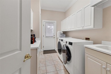 This beautiful custom designed home will captivate you from the on The Oaks Club in Florida - for sale on GolfHomes.com, golf home, golf lot