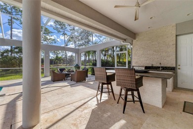 This beautiful custom designed home will captivate you from the on The Oaks Club in Florida - for sale on GolfHomes.com, golf home, golf lot