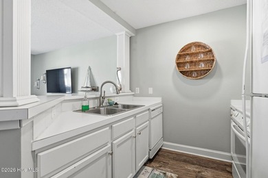 Embrace the essence of coastal living in this beautifully on Oyster Bay Golf Links in North Carolina - for sale on GolfHomes.com, golf home, golf lot