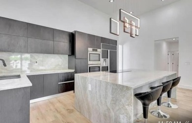 This fully renovated contemporary estate is nestled in the on Broken Sound Golf and Club  in Florida - for sale on GolfHomes.com, golf home, golf lot