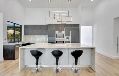 This fully renovated contemporary estate is nestled in the on Broken Sound Golf and Club  in Florida - for sale on GolfHomes.com, golf home, golf lot