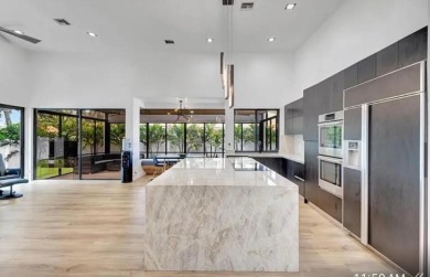 This fully renovated contemporary estate is nestled in the on Broken Sound Golf and Club  in Florida - for sale on GolfHomes.com, golf home, golf lot
