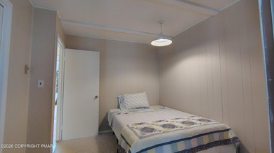 Escape to this cute-as-a-button 3-bedroom, 1-bath chalet with a on The Hideout Golf in Pennsylvania - for sale on GolfHomes.com, golf home, golf lot